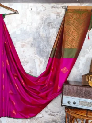 Vibrant magenta -pink with bottle green pallu.