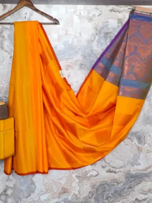 Vibrant Mango Yellow highlighted with blue pallu.