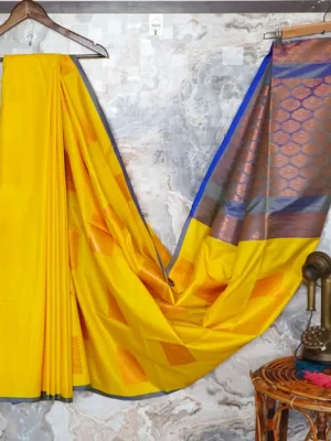 Yellow adorned with blue pallu.